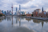 Fototapeta Nowy Jork - River And Modern Buildings Against Sky in Shanghai,China.