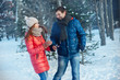© Dmitriy Shipilov - Guy and girl walk ,have fun in the forest in winter