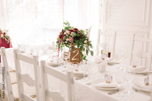 Wedding Table Decoration With The Red And Pink Flowers On The White