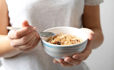 Wall Mural - Closeup of woman holding bowl with healthy breakfast