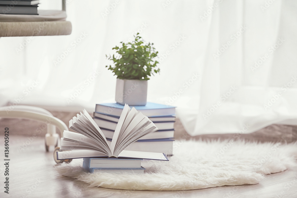 Pile of books on the floor at home