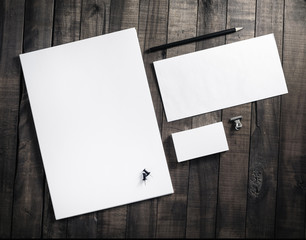 Wall Mural - Blank stationery set with plenty of copy space for placing your design. Blank letterhead, business cards, envelope and pencil. Corporate identity mockup on vintage wooden table background.