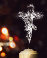 Wall Mural - Candle smoke in the shape of a cross