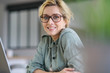 © goodluz - Portrait of blond woman working from home on laptop computer