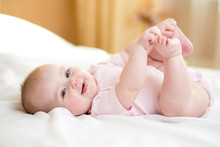 Funny Chubby Baby Infant Girl Playing With Her Feet