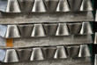 Stack of raw aluminum ingots in aluminum profiles factory