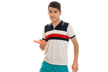 Wall Mural - young guy practicing a ping-pong isolated on white background