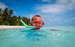 little boy swimming with mask at sea