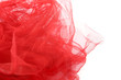 Red tulle fabric background. Abstract transparent material curve wave on white.