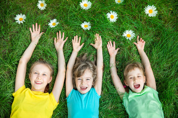 Wall Mural - Group of happy children playing outdoors