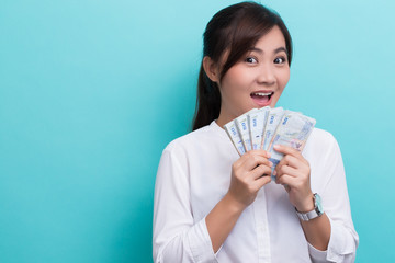 Asian woman happy saving fifty baht banknote