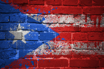 Wall Mural - painted national flag of puerto rico on a brick wall