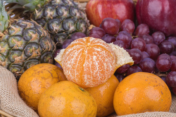 orange with fruits in basket