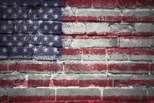 Painted National Flag Of United States Of America On A Brick Wall