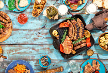 Wall Mural - Frame of food grilled on wooden table on sunny day