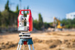 © ChomchoeiFoto - Tacheometer or theodolite surveyor equipment tool for engineering to survey outdoors are at construction site
