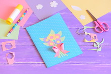 Creating A Greeting Card For Mom. Step. Card With Flowers Made Of Colored Paper. Materials For Kids Art On A Wooden Table. Gift Idea For Mother's Day, Birthday, March 8 For Preschool Children To Make
