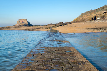 Wall Mural - Paved path to Grand Be and Petit Be islands at low tide in Saint Malo, Brittany, France