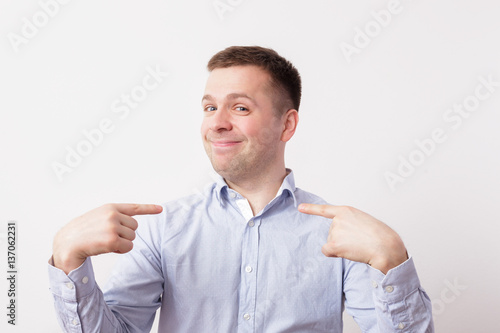 Fotografie, Obraz Self-satisfied and proud young man haughtily looks forward