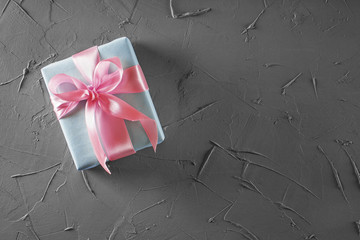 Gift boxes in craft paper on concrete background