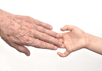 Hands of  old man and child