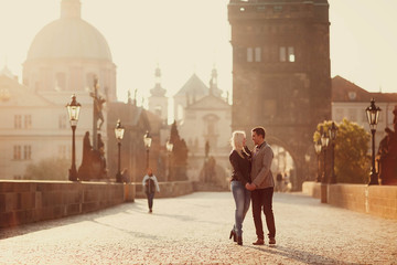 young and happy woman and man standing outdoors