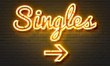 Singles neon sign on brick wall background.