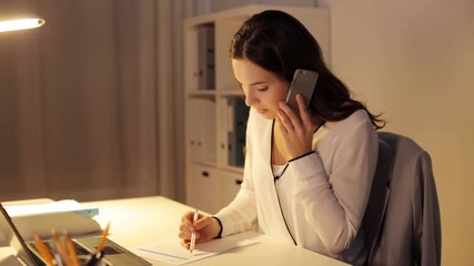 Canvas Print - woman with smartphone and papers at night office