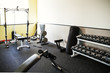 © Cavan Images - Exercise equipment in empty gym