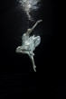 © H2Orobert - Young female ballet dancer dancing underwater