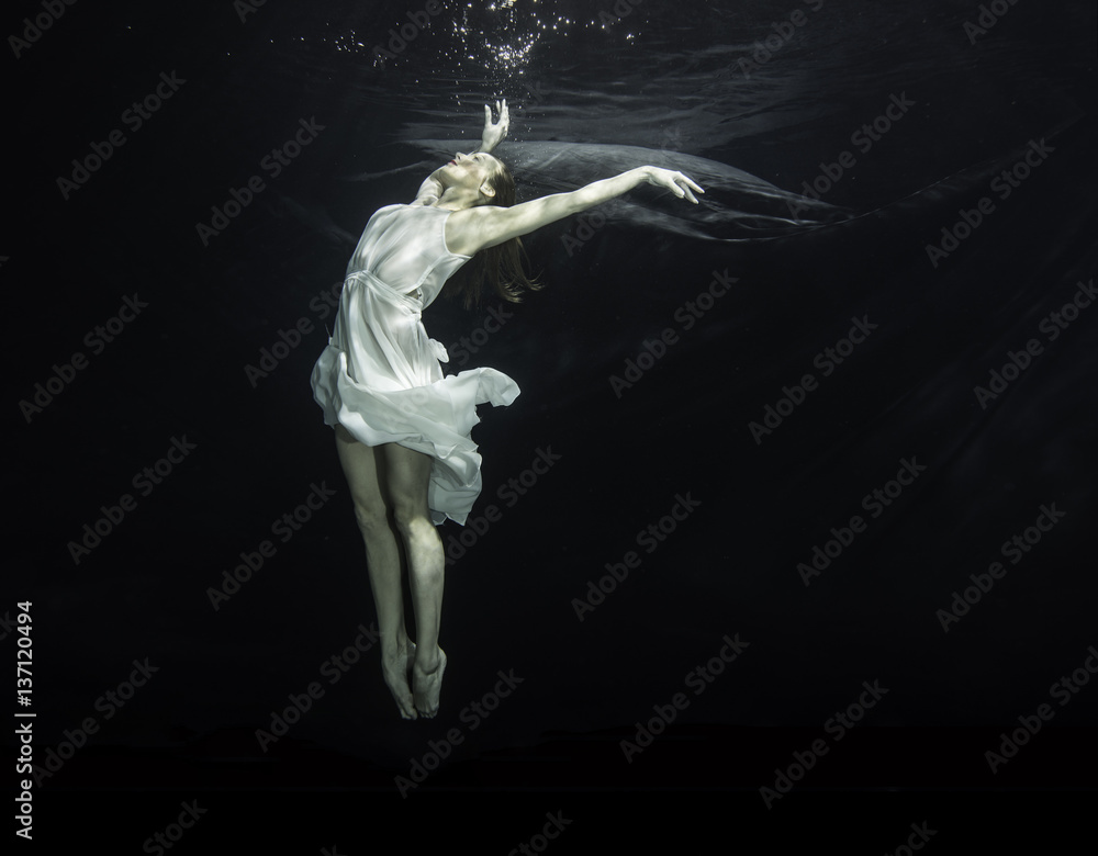 Young female ballet dancer dancing underwater Stock Photo | Adobe Stock
