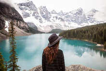 Woman Looking At View Of Lake And Mountains, Banff National Park, Alberta, Canada 