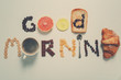 Phrase GOOD MORNING made of breakfast products on light background
