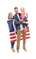 Wall Mural - Happy family with American flag on white background