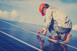 © only_kim - electrician working on  maintenance equipment at solar power plant; electrician swapping  solar panel with solar panel voltage drop