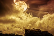 Boulder Against Sky With Clouds And Beautiful Full Moon. Outdoors. Sepia Tone.