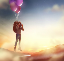 Wall Mural - Child flying on balloons