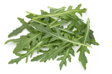 Wall Mural - Close up studio shot of green fresh rucola isolated on white background.