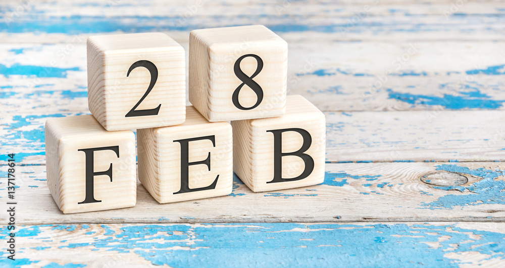 February 28th. Wooden cubes with date of 28 February on old blue wooden background. Stock Photo | Adobe Stock