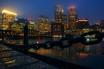Autocollant - view of boston skyscrapers night. rainy foggy weather, brilliant paving and lights of skyscrapers.