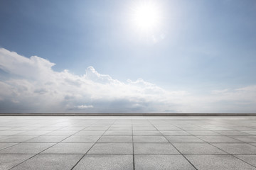 Wall Mural - empty brick floor in blue sunny sky