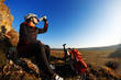 © Aleksey - Cross country biker drinking water with bike, sky background. side view