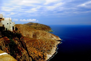 Wall Mural - Piece of Mediterranean cruise On Santorini island, Greece. The view from the hotel balcony on the lower terrace and the shore of the Aegean sea. The system of the Cycladic Islands. 