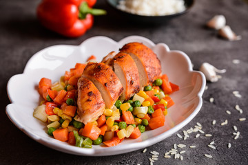 Wall Mural - Roasted chicken breasts with rice and steamed vegetable salad