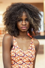 Wall Mural - Portrait of pretty afro-american girl with curly hair