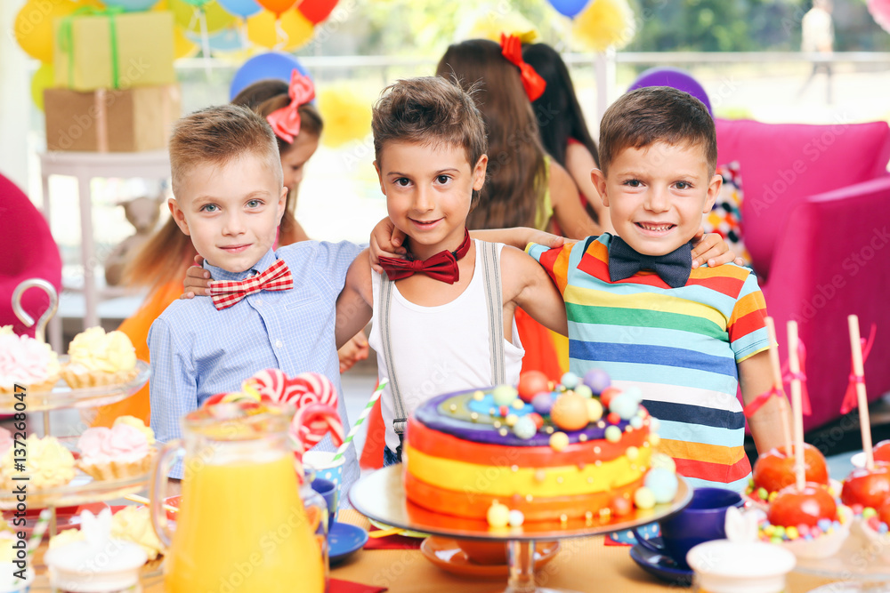 Children's funny birthday party in decorated room