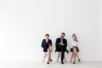 Wall Mural - Group of people waiting for job interview on white background