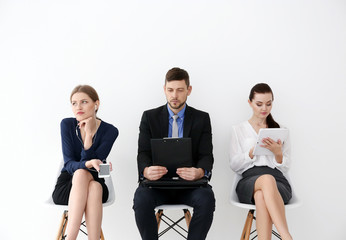 Wall Mural - Group of people waiting for job interview on white background