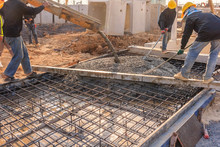 Concrete Pouring During Commercial Concreting Floors Of Buildings In Construction Site.