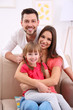 © Africa Studio - Happy family on sofa at home